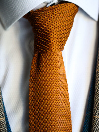 Rust knitted tie from Marc Darcy