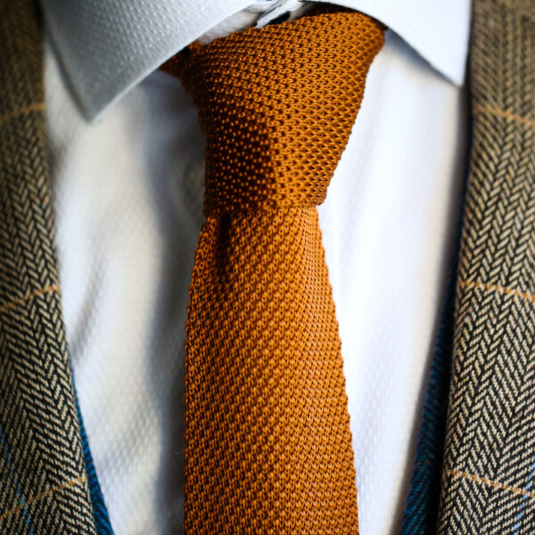 Rust knitted tie from Marc Darcy