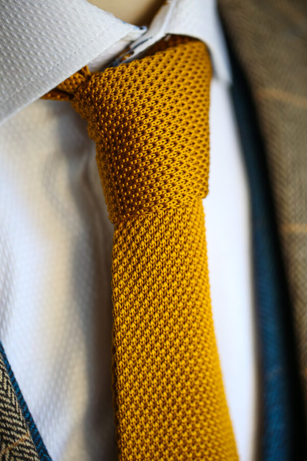 Gold knitted tie from Marc Darcy