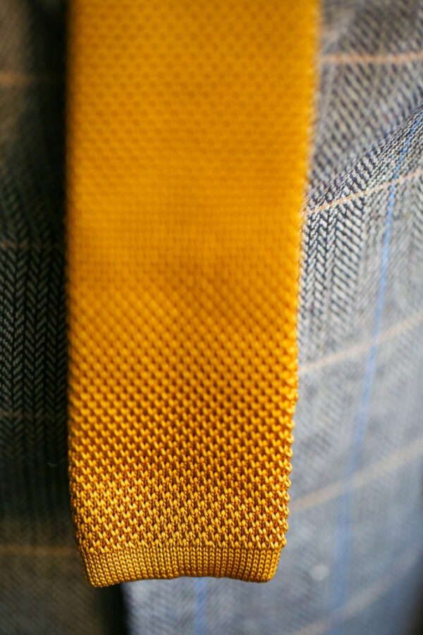 Gold knitted tie from Marc Darcy