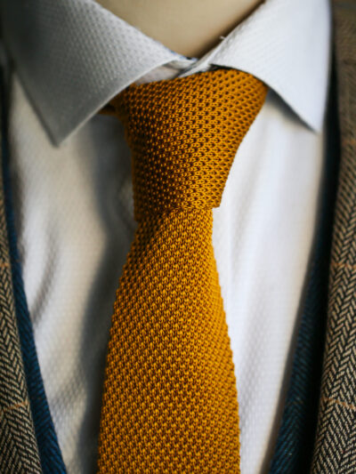 Gold knitted tie from Marc Darcy