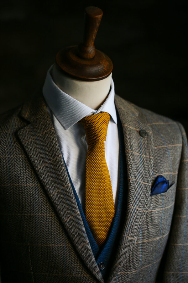 Gold knitted tie from Marc Darcy